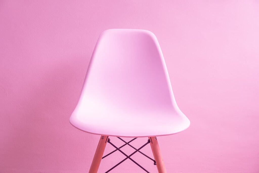Pink chair against pink wall - boost business growth